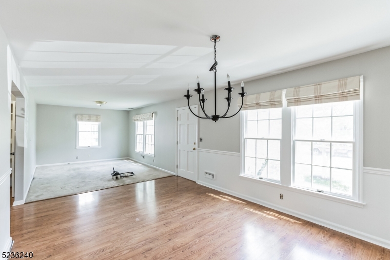 13 Wayne Boulevard Madison, NJ 07940 - Photo 4 of 19 a view of empty room with wooden floor and fan