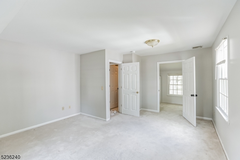 13 Wayne Boulevard Madison, NJ 07940 - Photo 6 of 19 a view of an empty room with a window