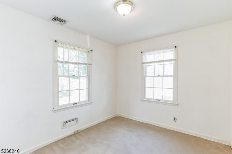 13 Wayne Boulevard Madison, NJ 07940 - Photo 7 of 19 an empty room with windows