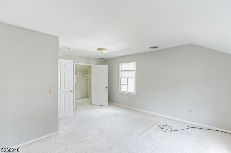 13 Wayne Boulevard Madison, NJ 07940 - Photo 8 of 19 a view of an empty room with a window