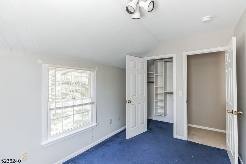 13 Wayne Boulevard Madison, NJ 07940 - Photo 10 of 19 an empty room with windows and closet