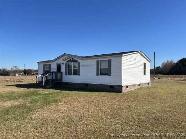 a house view with a backyard space