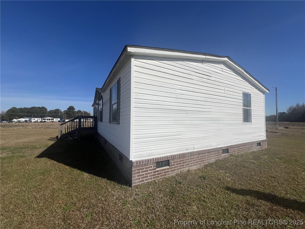 2964 Popes Crossing Road Lumberton, NC 28358 - Photo 23 of 26 a view of a house with backyard