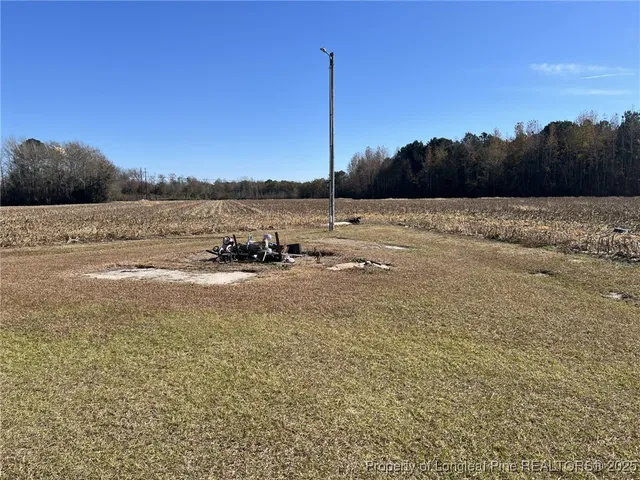 a view of a field with ocean view