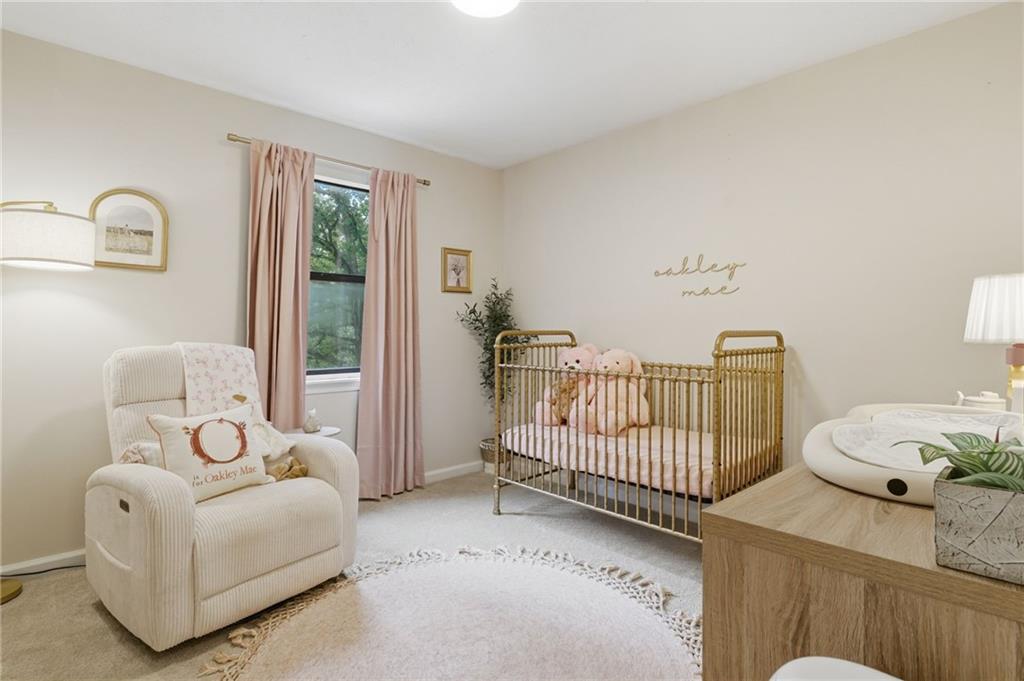 404 Brooks Street Dallas, GA 30157 - Photo 21 of 38 a bedroom with furniture and a window