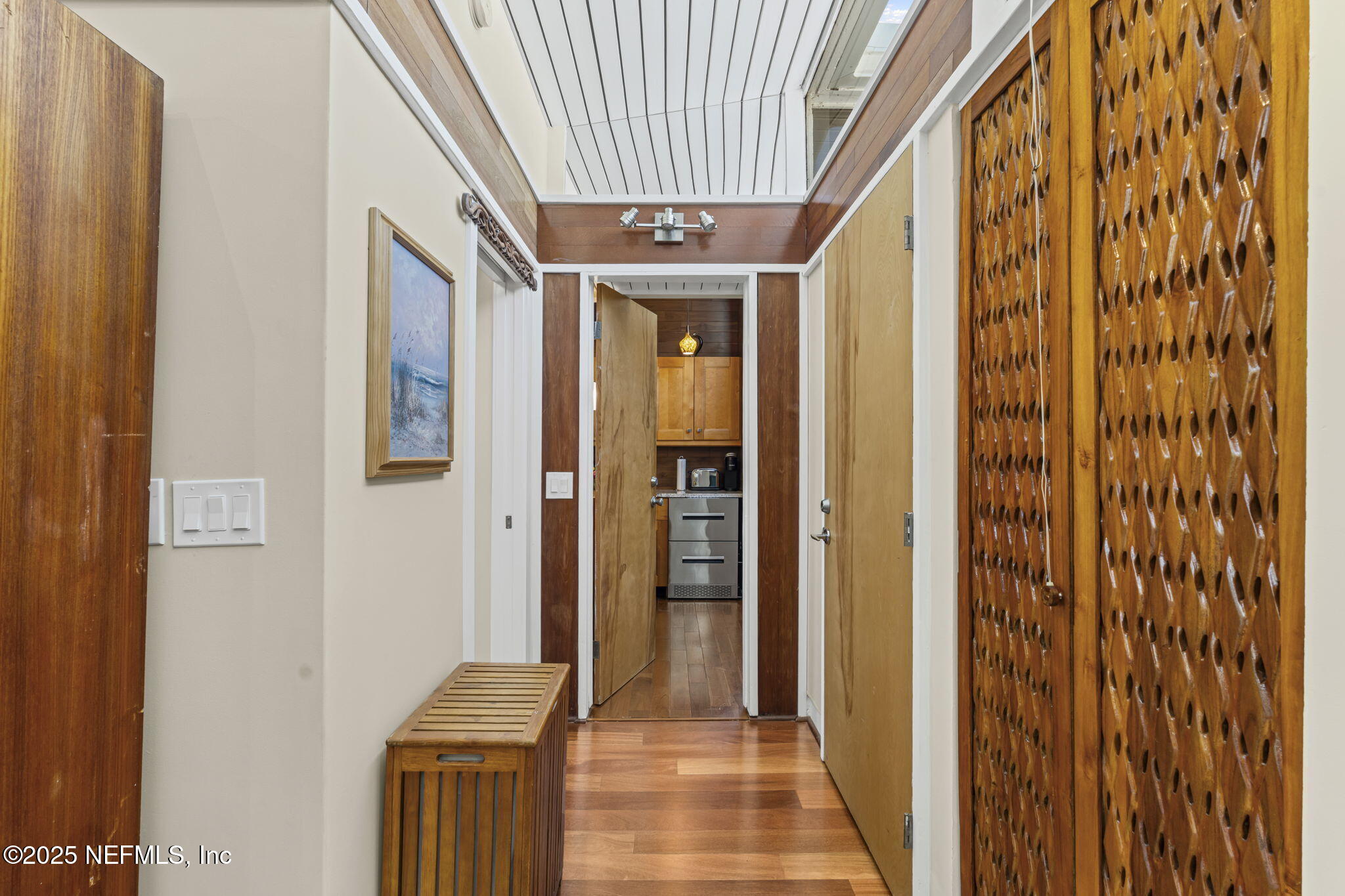 2337 Seminole Road, Unit B Atlantic Beach, FL 32233 - Photo 17 of 19 a view of a hallway with wooden floor and staircase