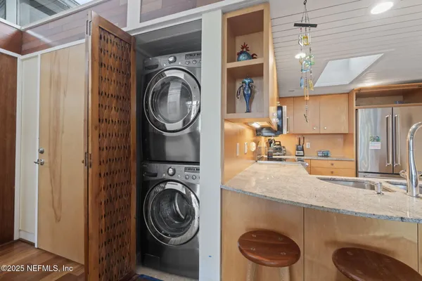 a living room with furniture a fireplace and a table