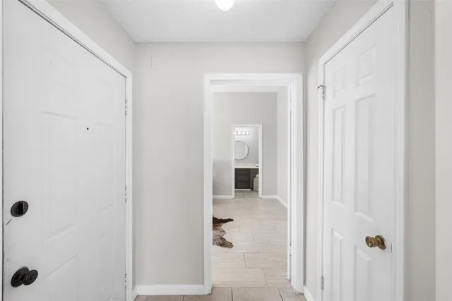 a view of a bathroom from a hallway
