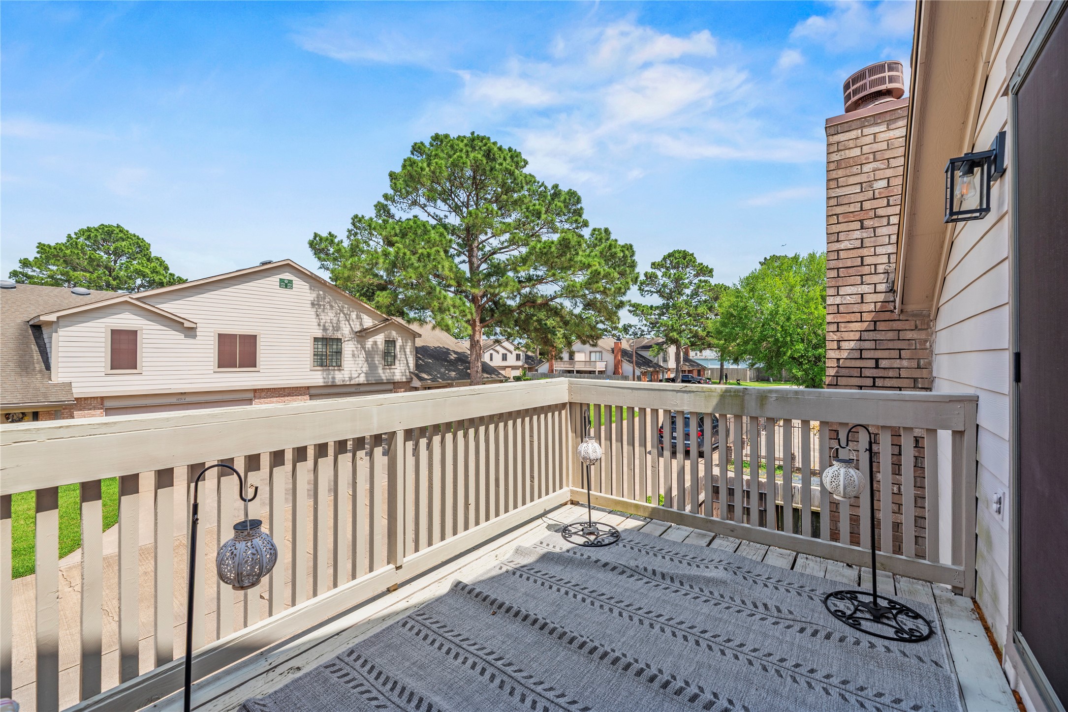 16913 Chapel Pines Drive, Unit 126 Spring, TX 77379 - Photo 24 of 27 Charming balcony with a wooden railing, offering a peaceful place to relax.