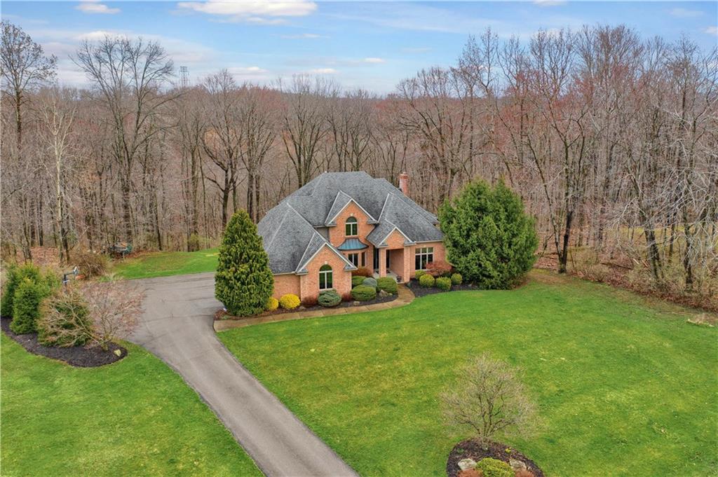 115 Cedar Ridge Butler, PA 16001 - Photo 25 of 25 a view of a garden with a house in the background