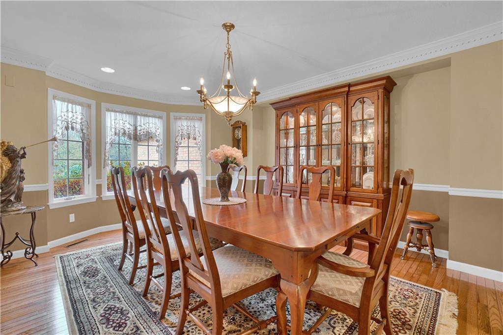 115 Cedar Ridge Butler, PA 16001 - Photo 5 of 25 a view of a dining room with furniture wooden floor and chandelier