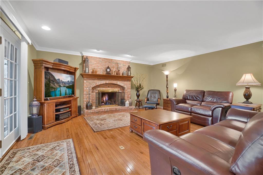 115 Cedar Ridge Butler, PA 16001 - Photo 8 of 25 a living room with furniture and a fireplace
