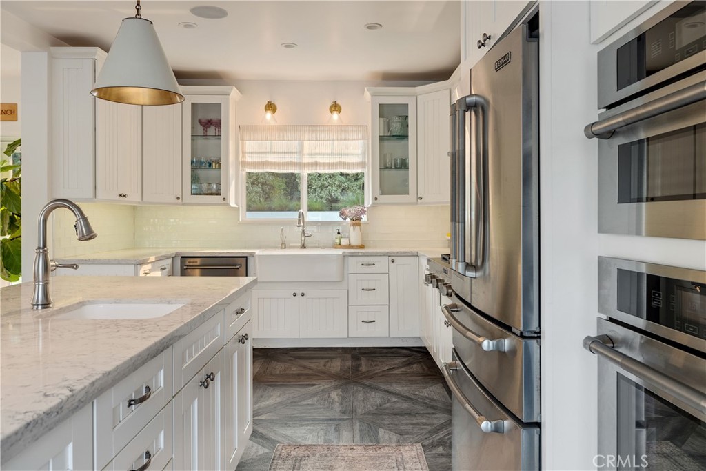 1006 Ave H Redondo Beach, CA 90277 - Photo 19 of 75 a kitchen with a sink stove and refrigerator
