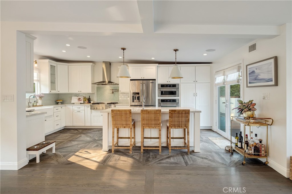 1006 Ave H Redondo Beach, CA 90277 - Photo 21 of 75 a living room with stainless steel appliances kitchen island granite countertop furniture and a dining table with wooden floor
