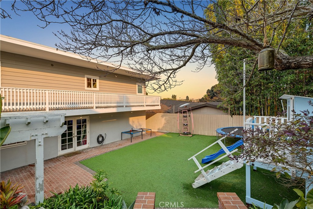 1006 Ave H Redondo Beach, CA 90277 - Photo 32 of 75 a view of a backyard with a small cabin and a chair