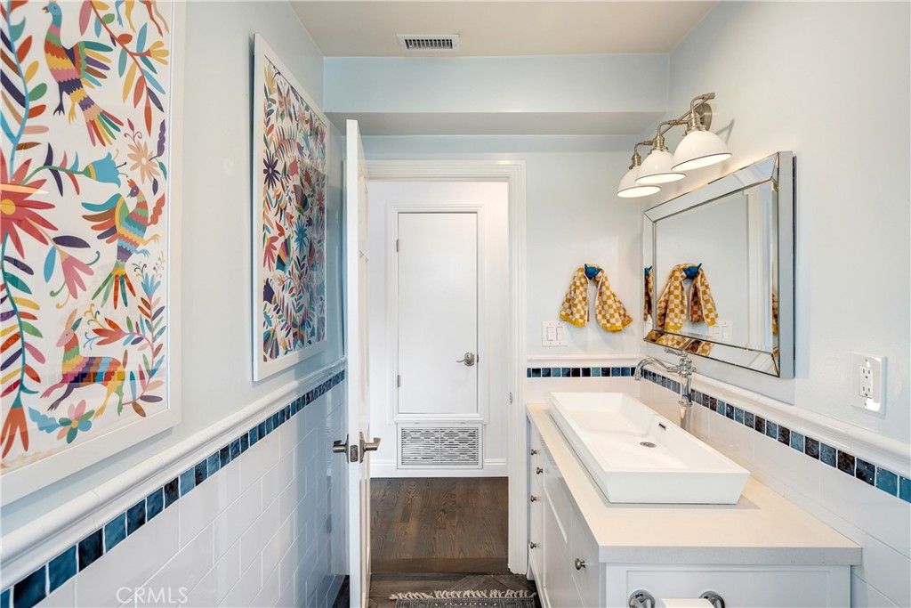 1006 Ave H Redondo Beach, CA 90277 - Photo 47 of 75 a bathroom with a sink mirror and vanity