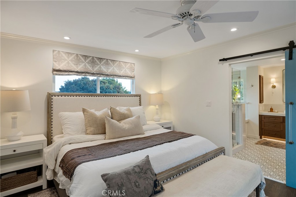 1006 Ave H Redondo Beach, CA 90277 - Photo 54 of 75 a bedroom with a bed and a chandelier