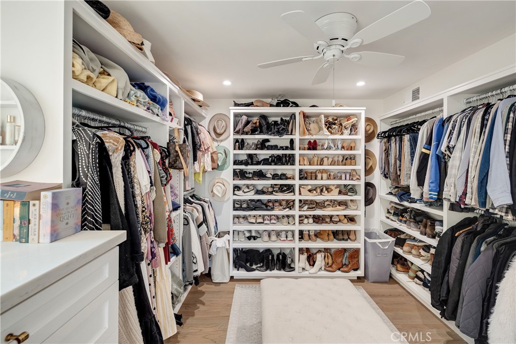 1006 Ave H Redondo Beach, CA 90277 - Photo 59 of 75 a view of walk in closet with clothes and shoes