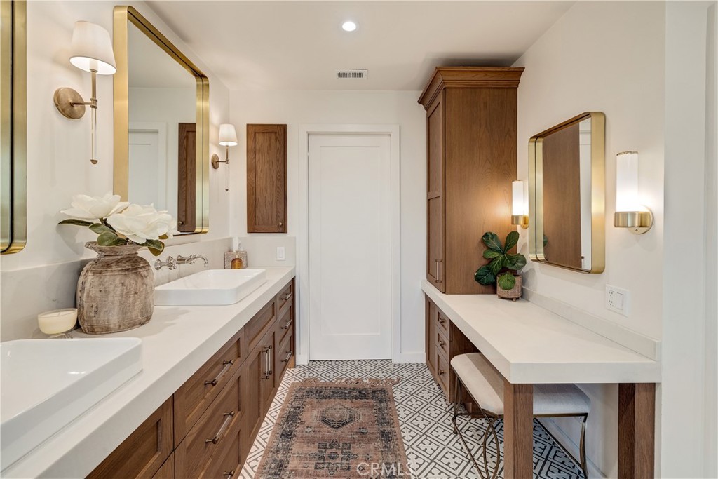 1006 Ave H Redondo Beach, CA 90277 - Photo 60 of 75 a bathroom with a double vanity sink and a mirror