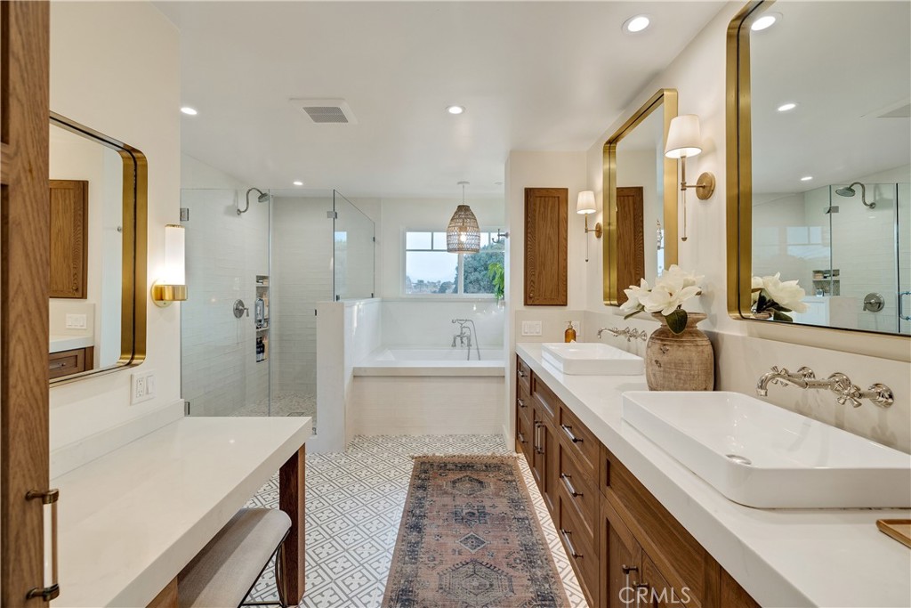 1006 Ave H Redondo Beach, CA 90277 - Photo 62 of 75 a spacious bathroom with a double vanity sink a mirror and a shower