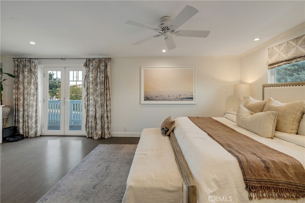 1006 Ave H Redondo Beach, CA 90277 - Photo 63 of 75 a spacious bedroom with a bed and a chandelier