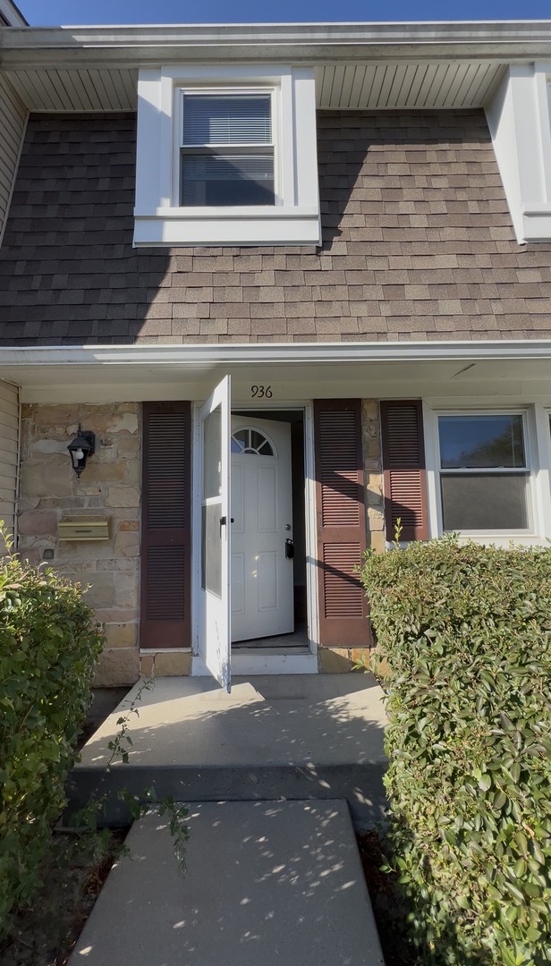 936 Cardiff Court Schaumburg, IL 60169 - Photo 1 of 11 a front view of a house with a yard