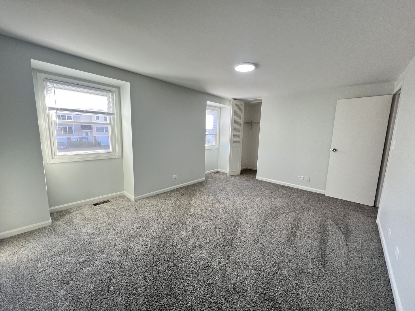 936 Cardiff Court Schaumburg, IL 60169 - Photo 9 of 11 a view of an empty room and a window