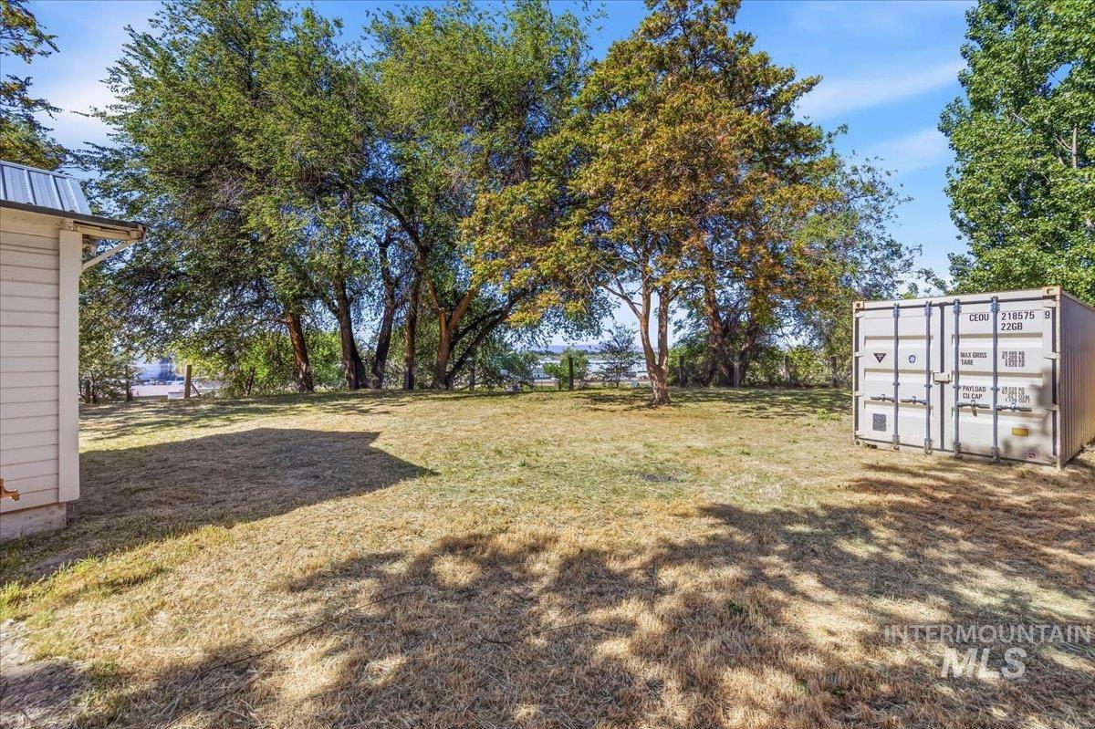 109 Parma Road Parma, ID 83660 - Photo 26 of 31 Expansive grassy area with mature trees providing partial shade