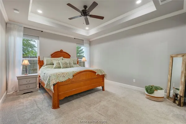 a bedroom with a bed and window