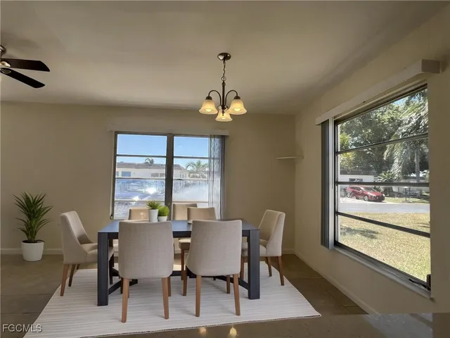 a view of a dining room with furniture window and outside view