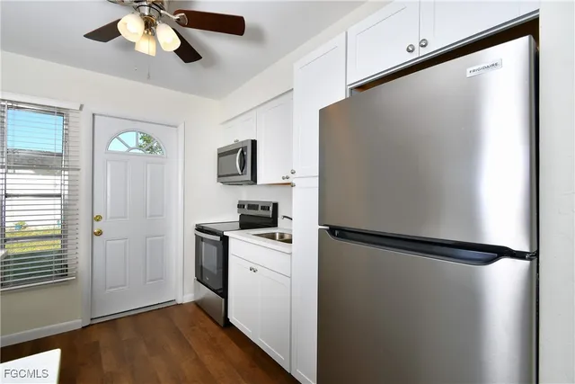 a kitchen with a refrigerator a sink and dishwasher