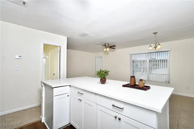 a view of a bathroom with a sink and a mirror