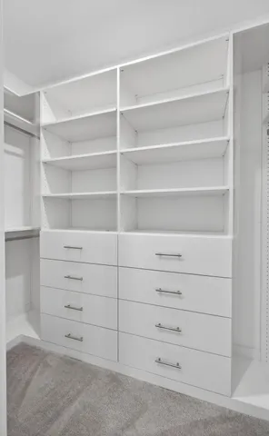 a view of an empty walk in closet