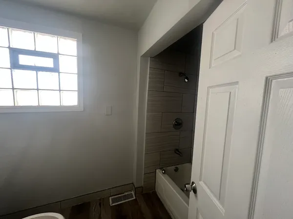 an entryway with a mirror