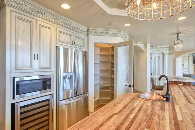 a spacious bathroom with a granite countertop sink mirror and bathtub