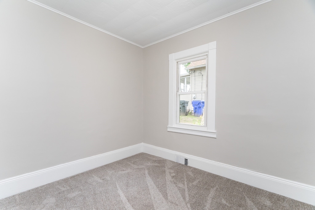 39 Ambrose Street Springfield, MA 01109 - Photo 11 of 23 an empty room with a window
