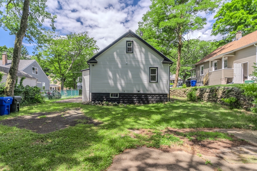39 Ambrose Street Springfield, MA 01109 - Photo 23 of 23 a front view of house with yard and green space