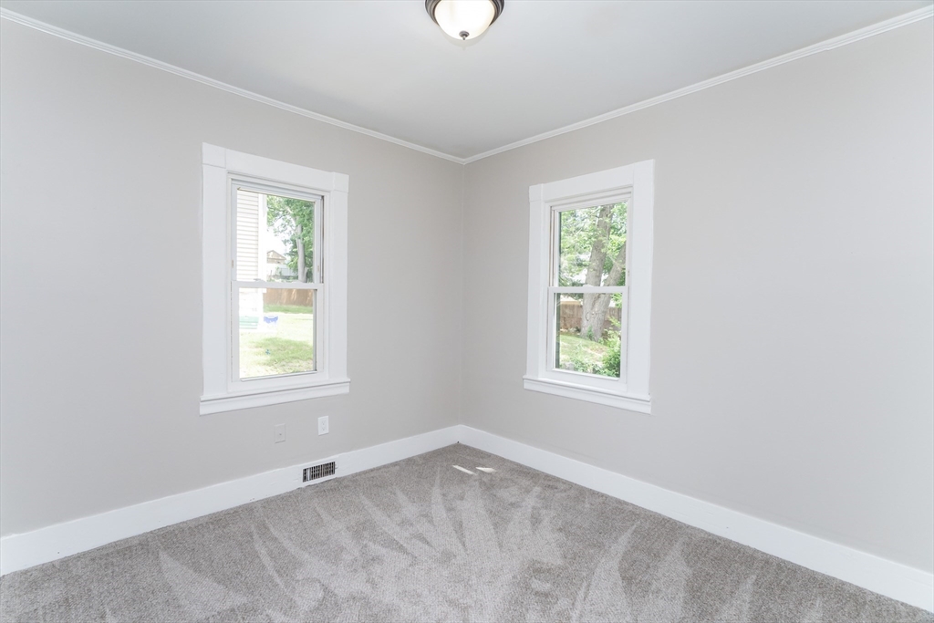 39 Ambrose Street Springfield, MA 01109 - Photo 9 of 23 an empty room with a window