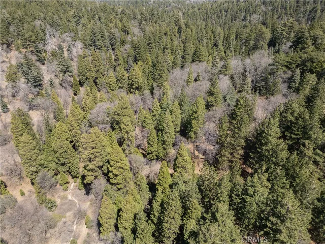 a view of a town with mountains in the background