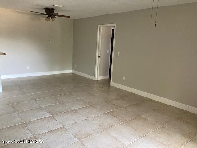 7667 North Wickham Road, Unit 502 Melbourne, FL 32940 - Photo 15 of 19 a view of a room with an empty space and a ceiling fan