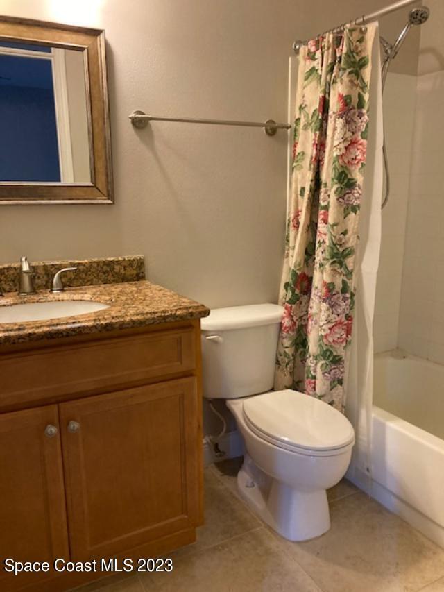 7667 North Wickham Road, Unit 502 Melbourne, FL 32940 - Photo 4 of 19 a bathroom with a sink toilet and shower