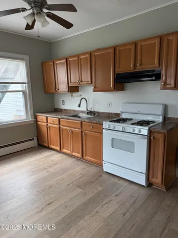 a kitchen with stainless steel appliances granite countertop a stove and a sink