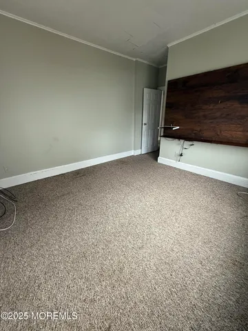 a view of room with a flat screen tv