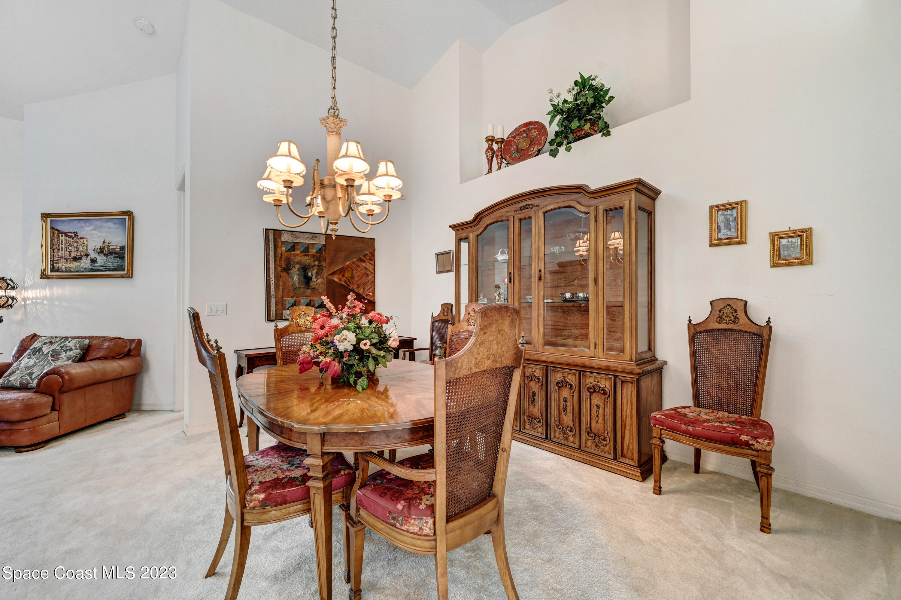 368 Renaissance Avenue Melbourne, FL 32940 - Photo 5 of 29 a view of a dining room with furniture and chandelier