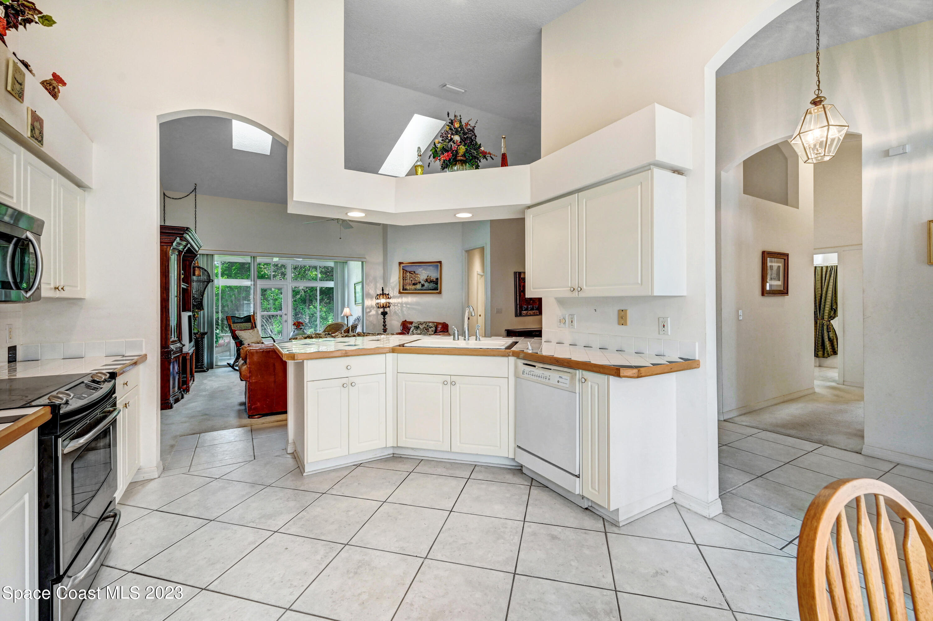 368 Renaissance Avenue Melbourne, FL 32940 - Photo 10 of 29 a kitchen with a sink appliances and cabinets