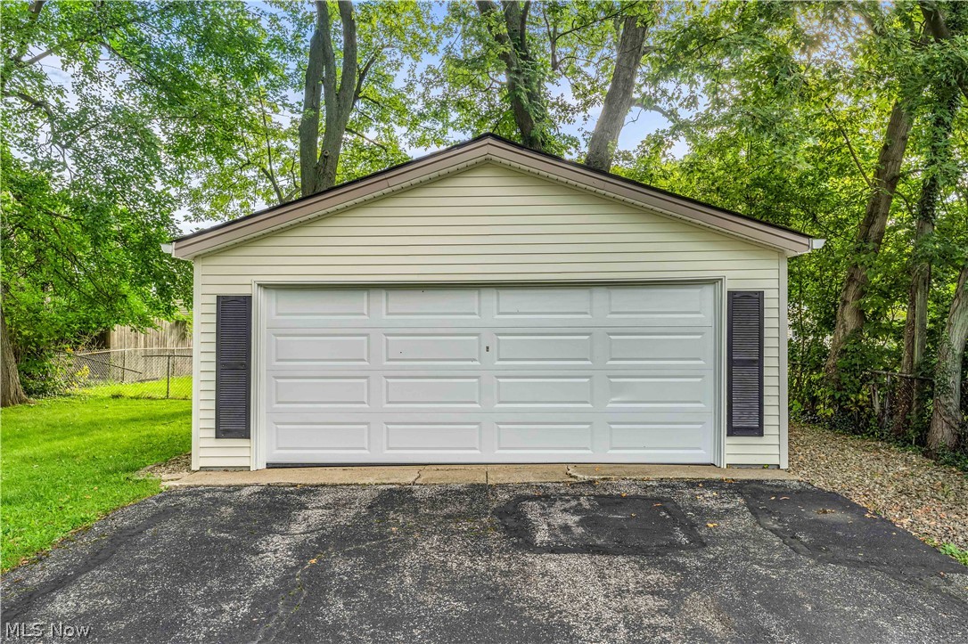 1563 Commodore Road Lyndhurst, OH 44124 - Photo 33 of 37 Over sized two car garage with new roof and garage door + storage above