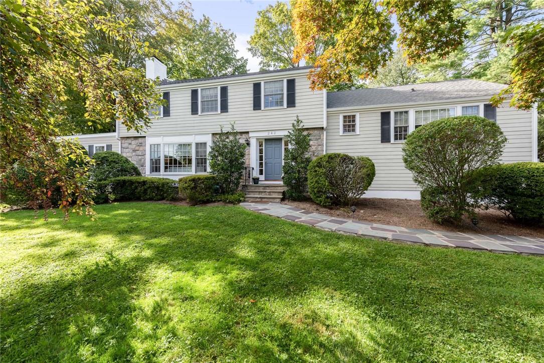 242 Sunny Ridge Road Harrison, NY 10528 - Photo 1 of 1 a view of a house with backyard and garden