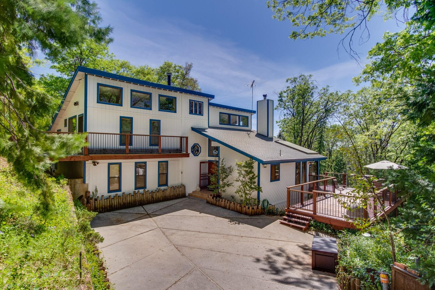14226 Storm Ridge Road Grass Valley, CA 95945 - Photo 1 of 1 a aerial view of a house with a yard and potted plants