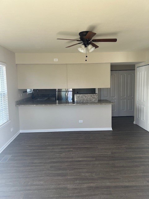 1842 Shetland Road Naperville, IL 60565 - Photo 13 of 30 a view of a livingroom with wooden floor and a ceiling fan