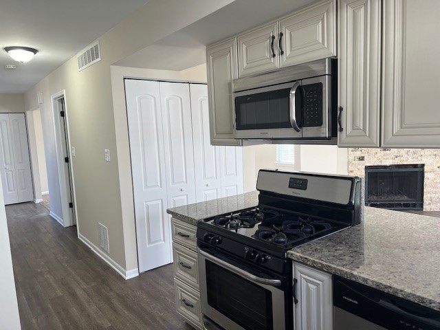1842 Shetland Road Naperville, IL 60565 - Photo 9 of 30 a kitchen with granite countertop stainless steel appliances and white cabinets